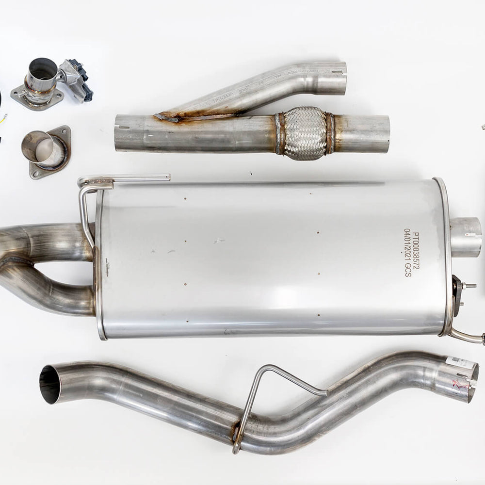 Image of a car exhaust system laid out on a white background, featuring piping, connectors, electrical wires, and a high-performance muffler with Roush Performance valve technology.